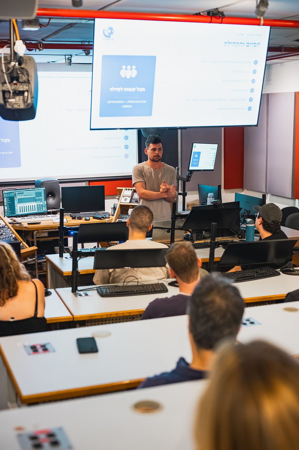 Facilitator leading a session in the studio