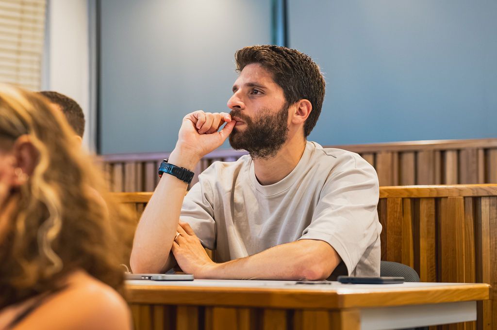 A participant listening attentively during the workshop